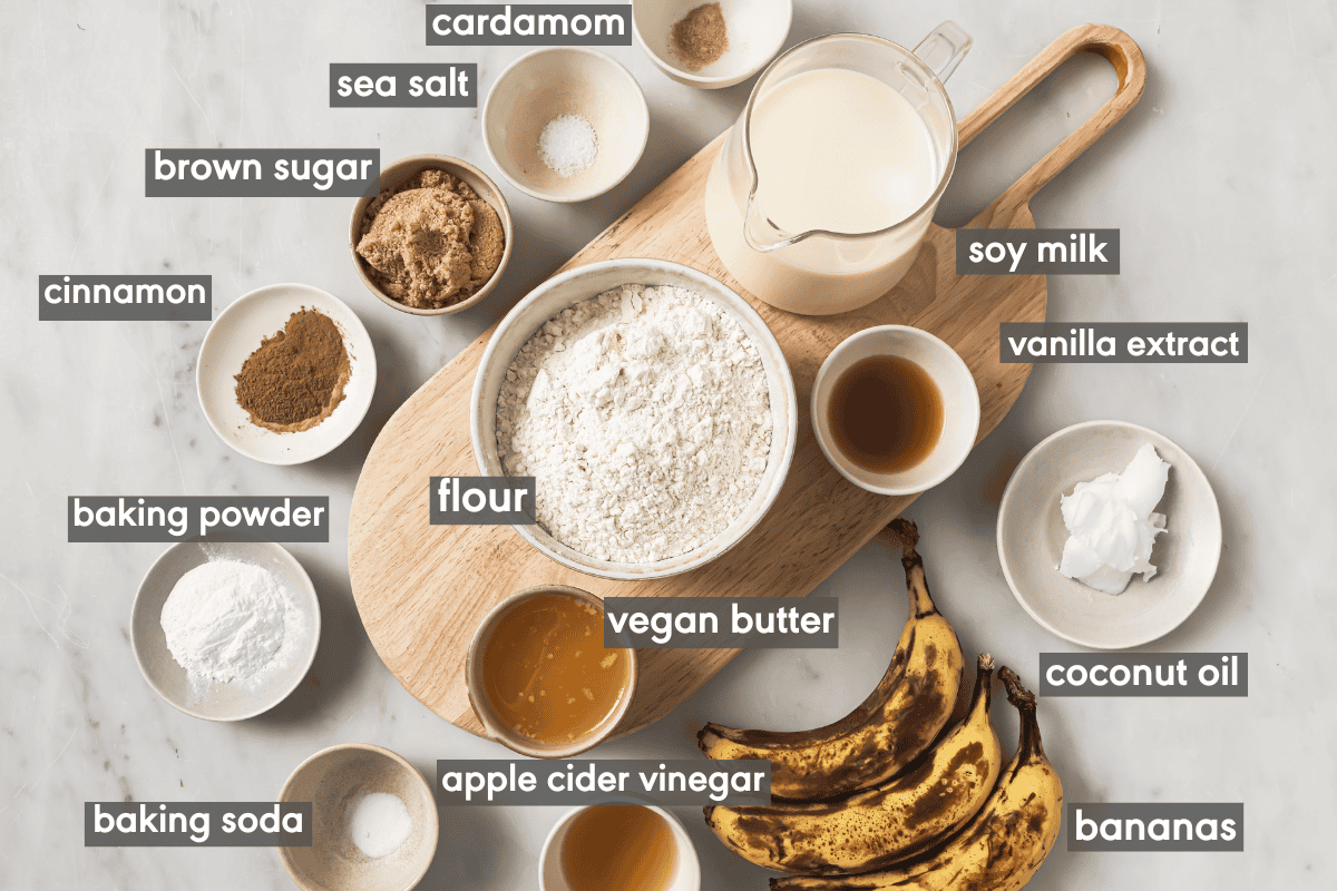 various ingredients for banana pancakes in small bowls on a table.