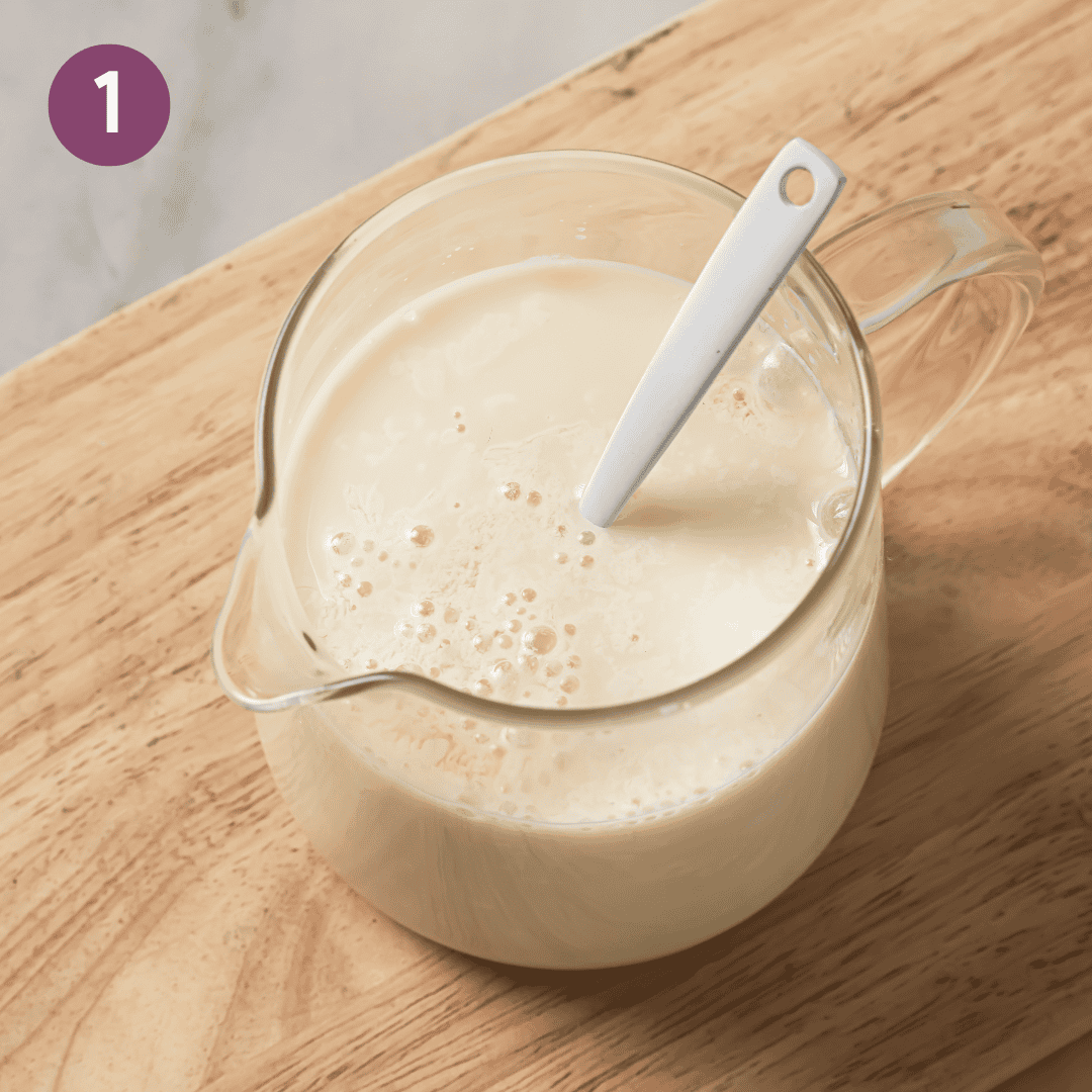 Vinegar and soy milk in a glass jar.