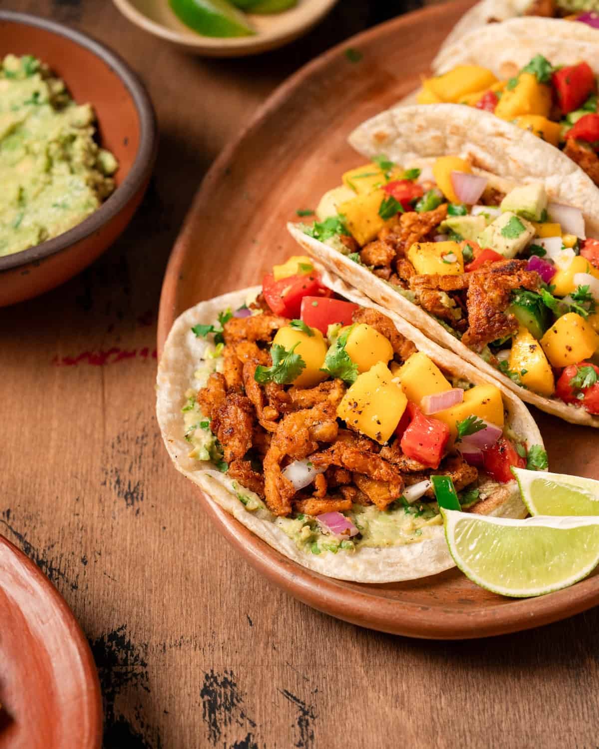 close up view of vegan tacos with soy curls on a platter.