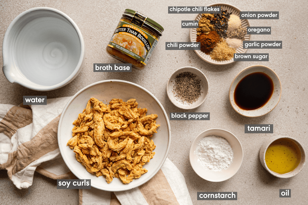 ingredients for taco spiced soy curls in various bowls on a table.