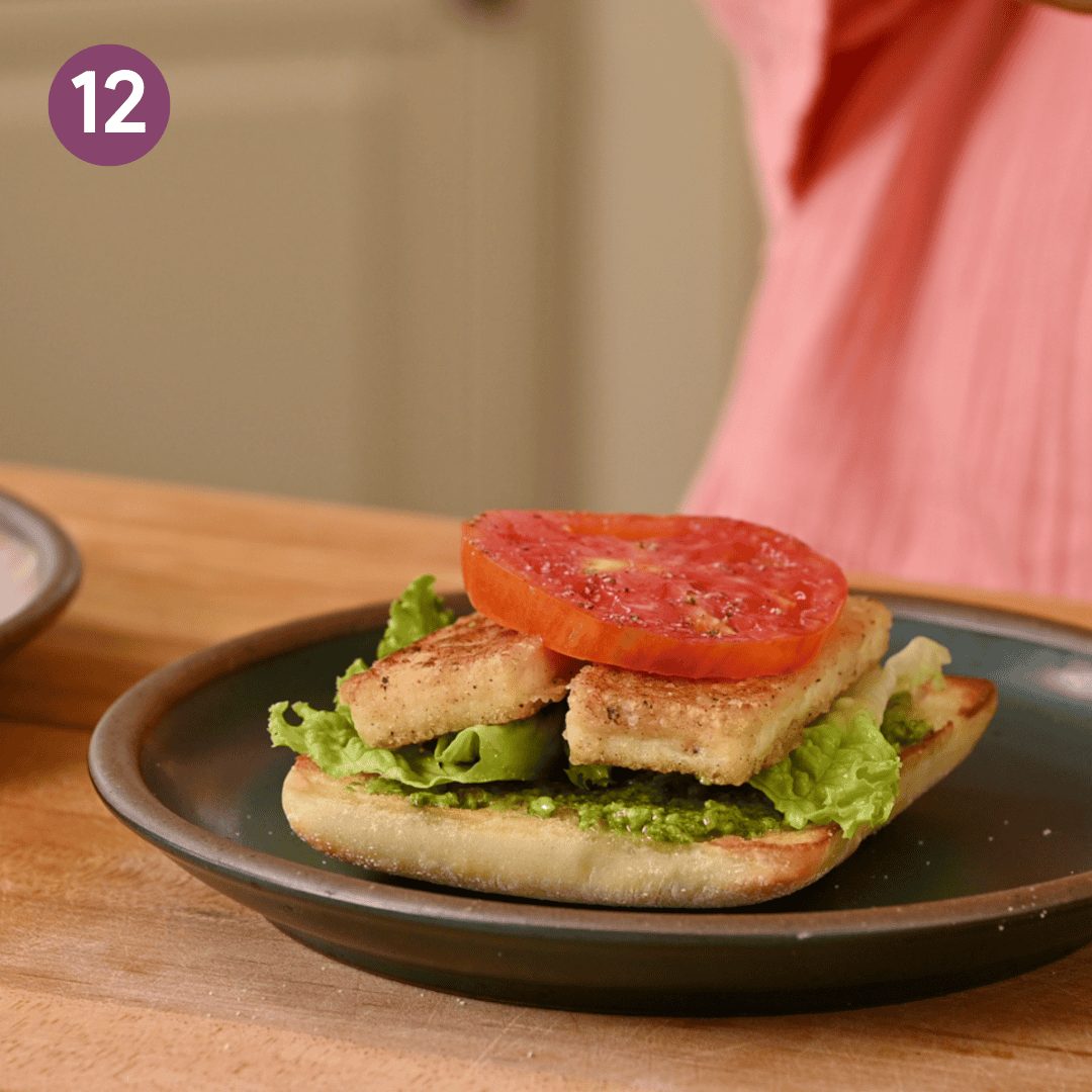 Tofu, lettuce and tomato added to one side of the sandwich.