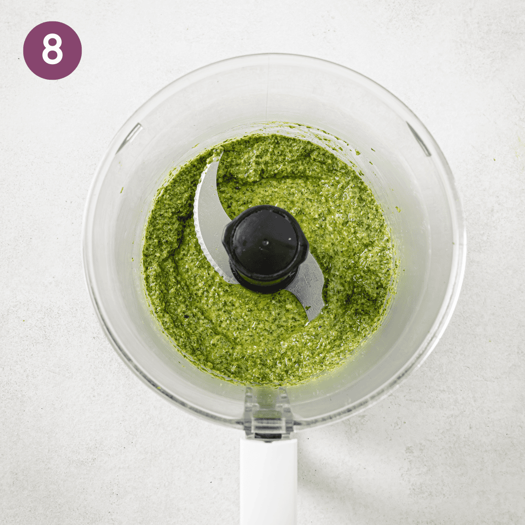 Pesto in a food processor after being blended.