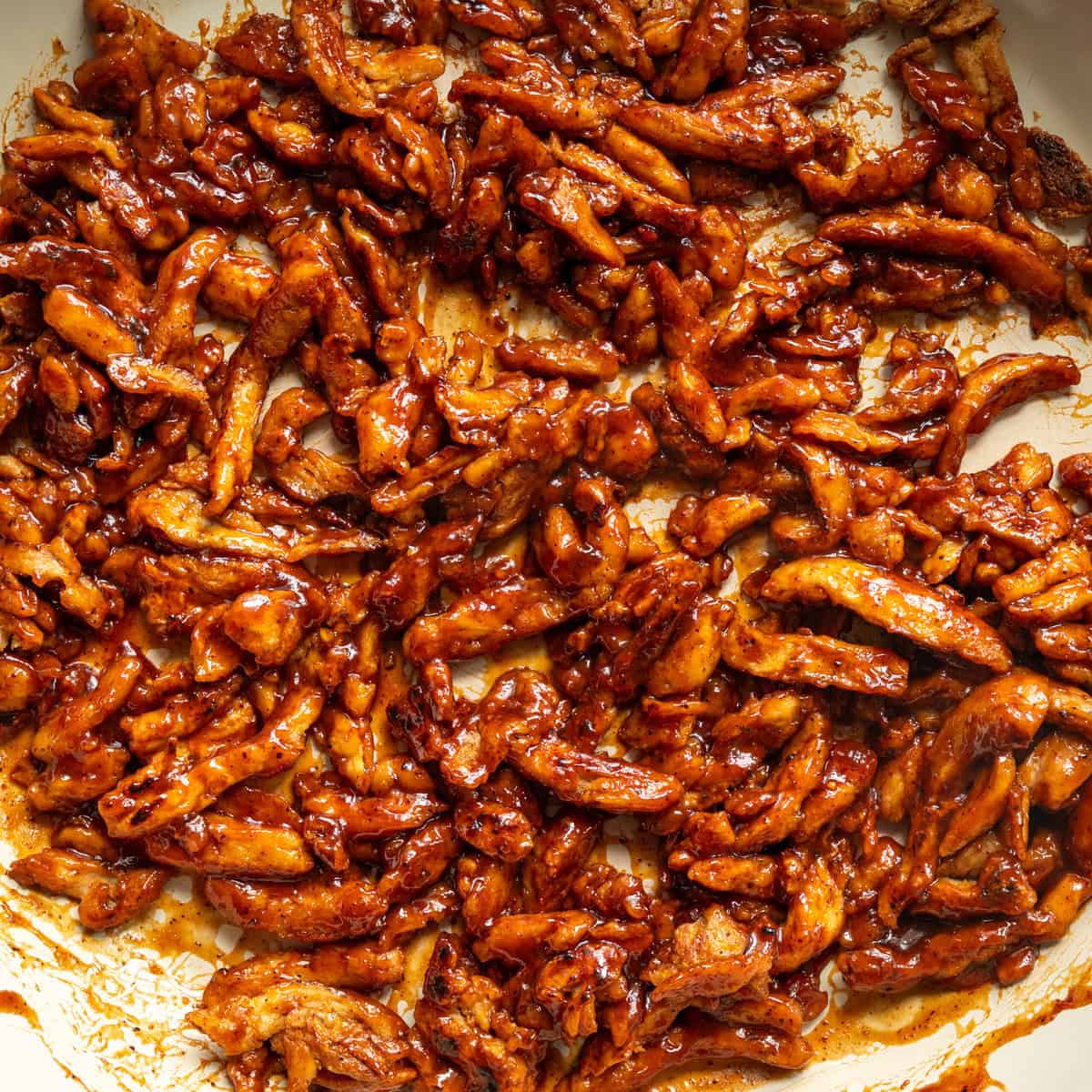 close up of bbq soy curls in a saucepan.