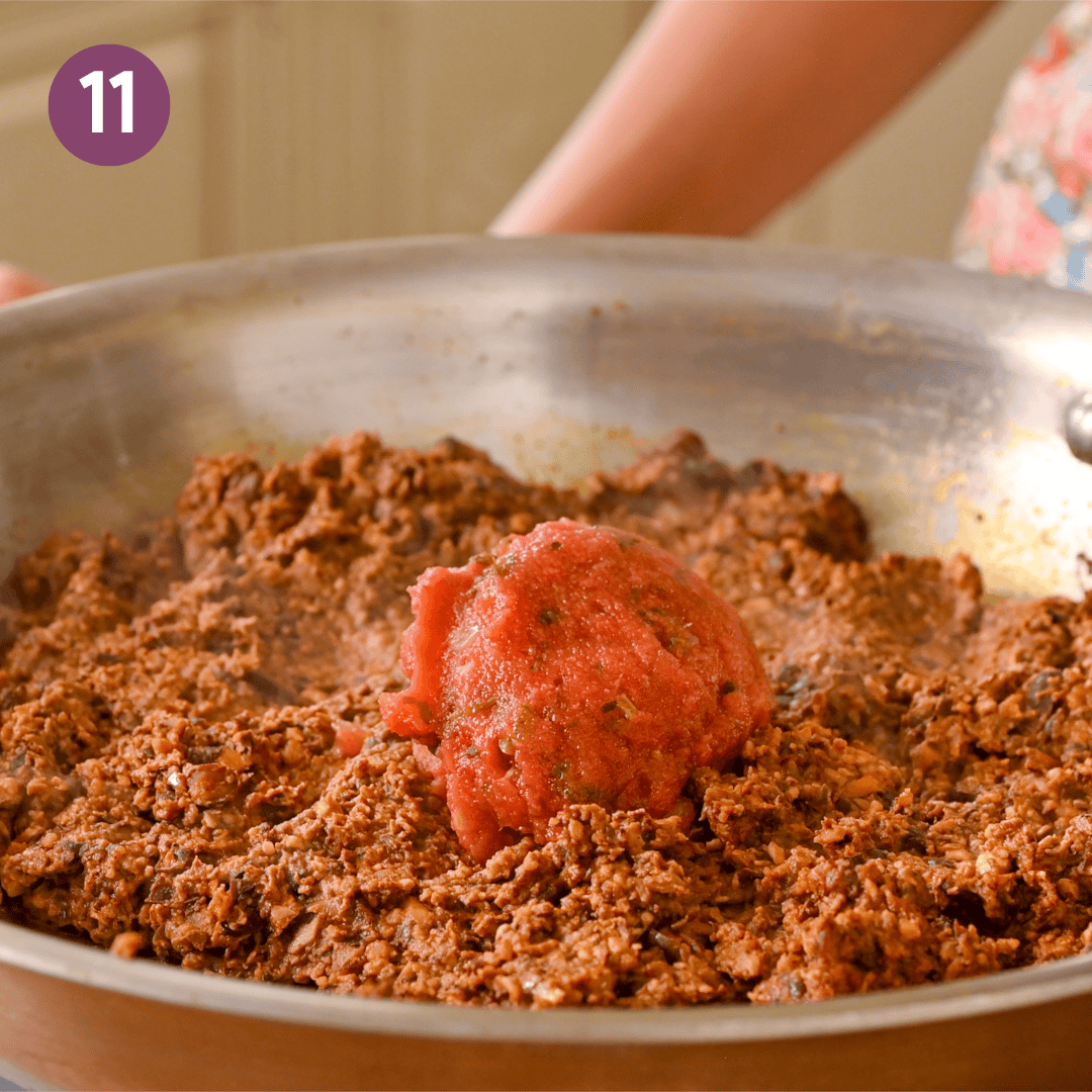 salsa added to bean mushroom mixture in pan.