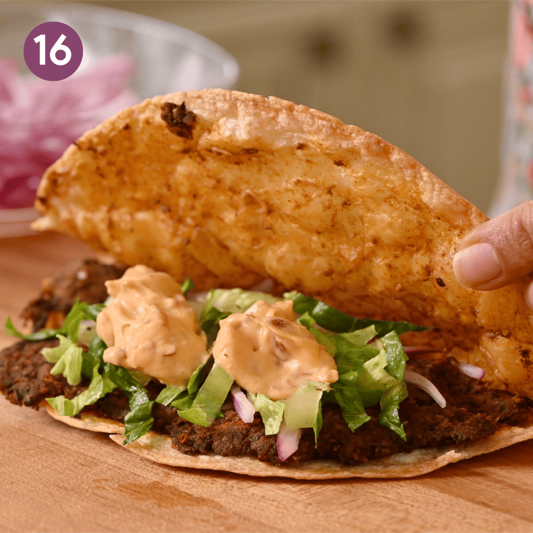 crispy black bean tacos filled with pickled onions, lettuce and chipotle crema.