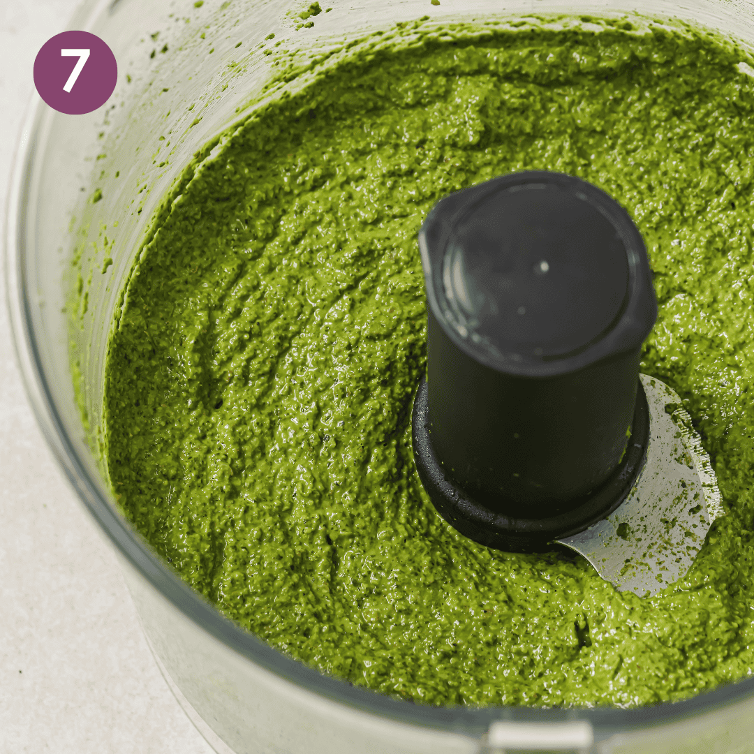 the final blended spinach pesto in the food processor.