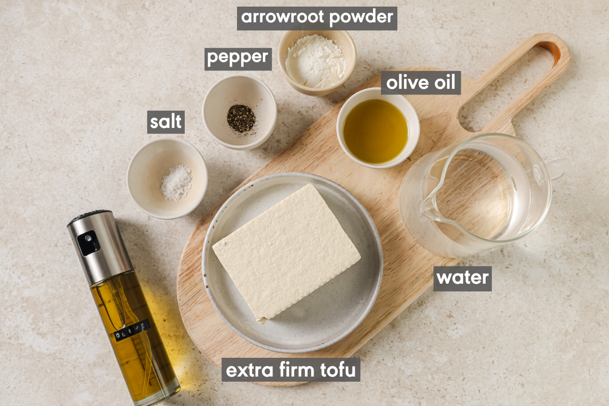 ingredients for air fried tofu in various bowls on a table.