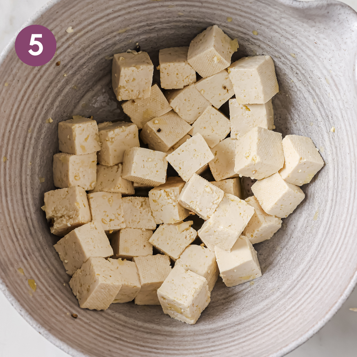 tofu cubes with olive oil, salt and pepper.
