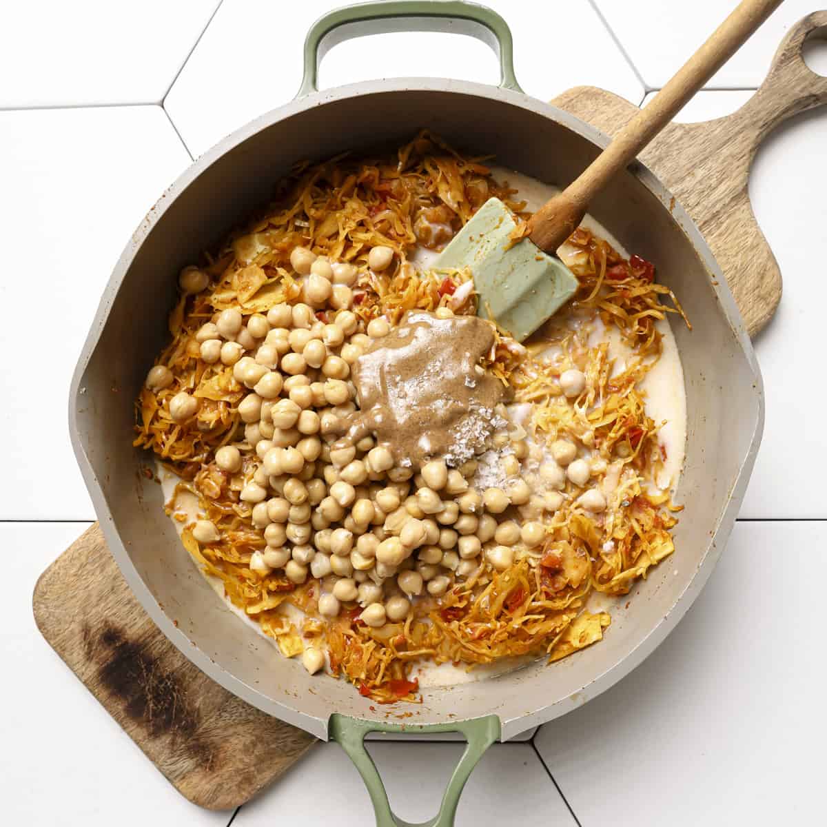 coconut milk, chickpeas, almond butter and salt added to the cabbage.