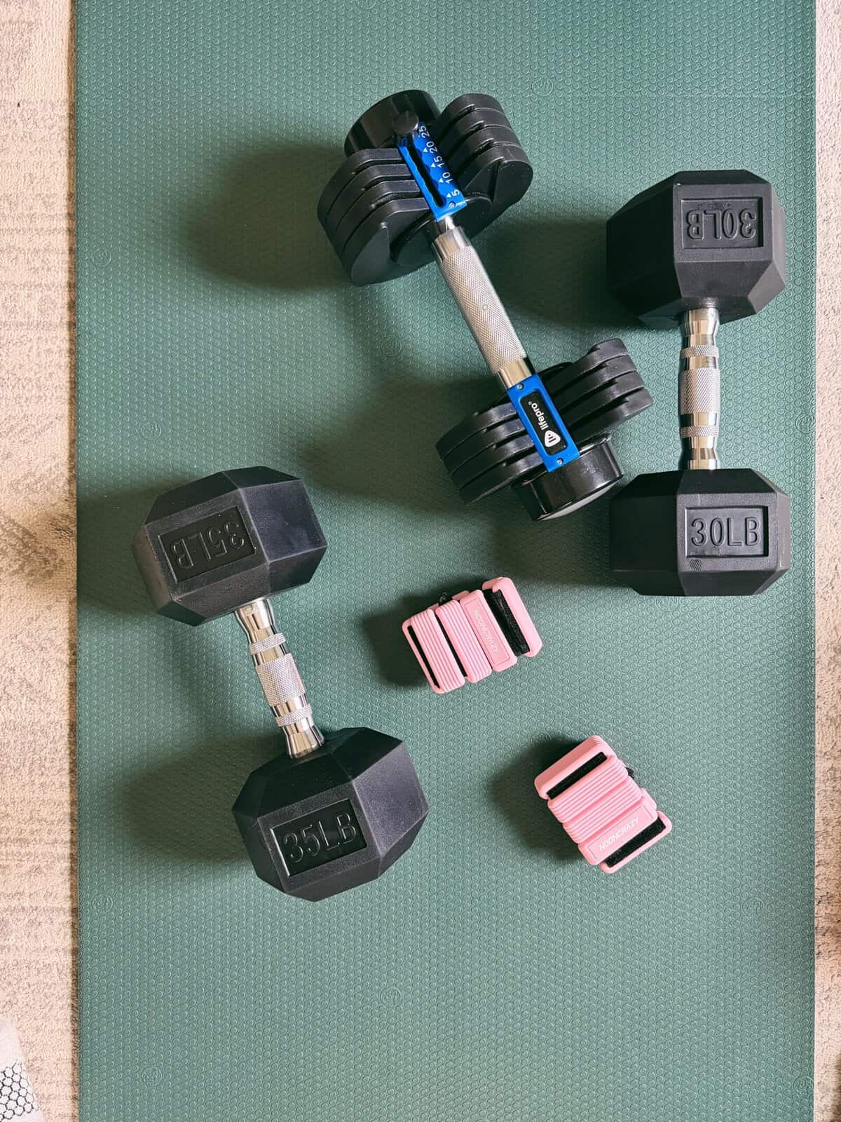 heavy dumbbells on yoga mat.