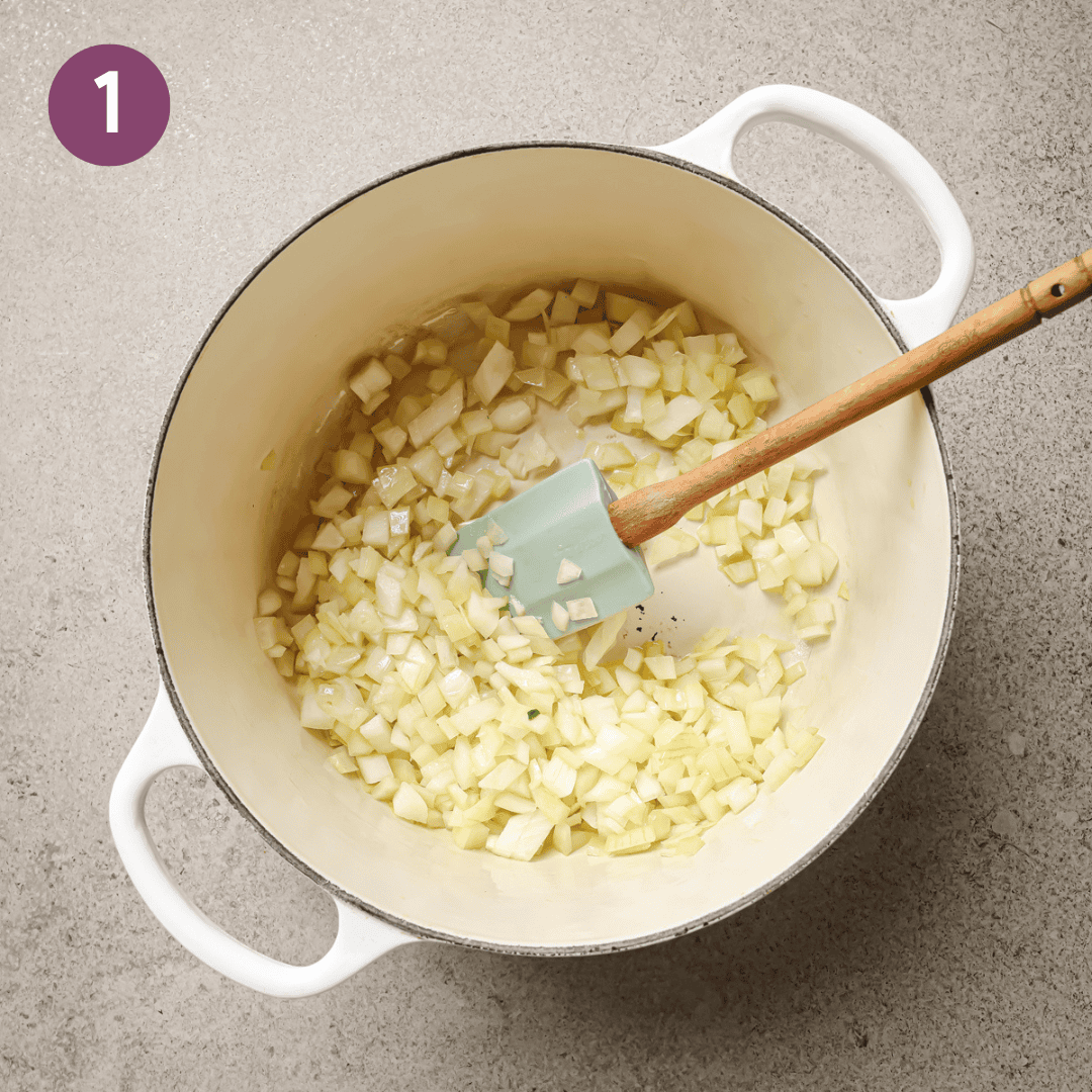 Diced onions being sauteed in adutch oven.