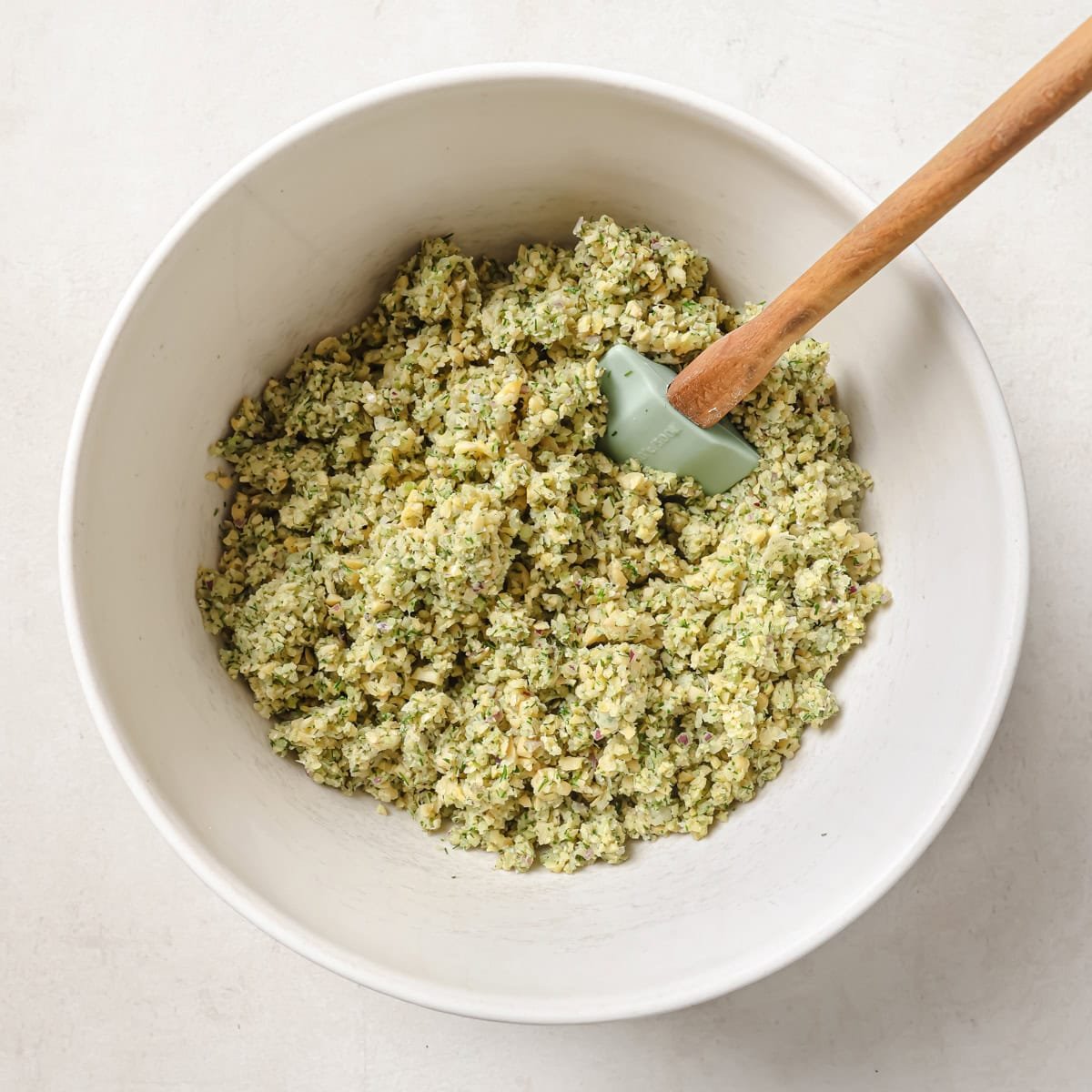 chickpea mixture in a large bowl with a silicone spatula.