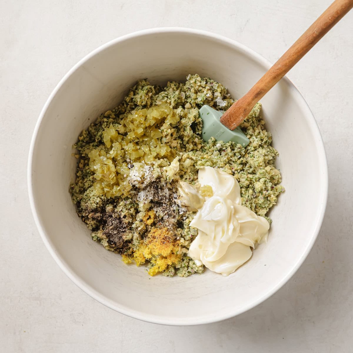 remaining chickpea salad ingredients added to the large bowl with the chickpea mixture before being combined.