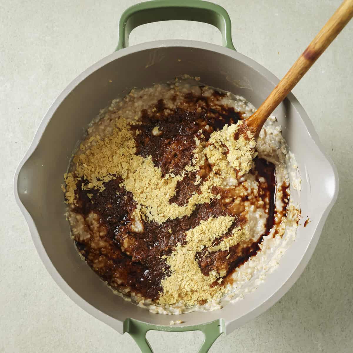 nutritional yeast and soy sauce added to the oats in the pot.