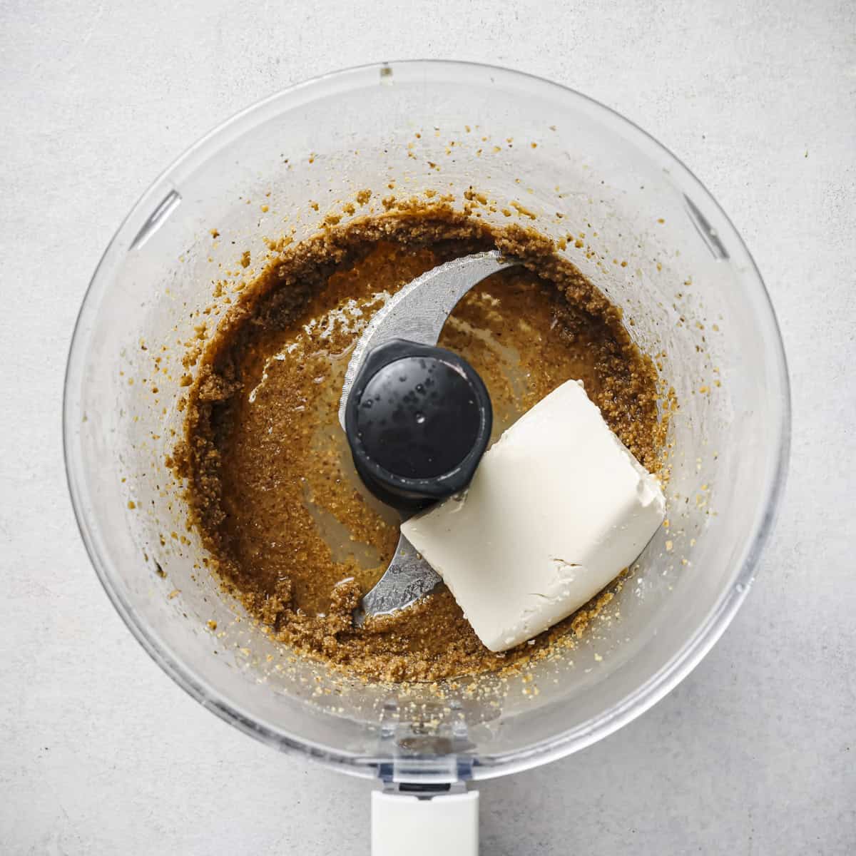 tofu and lemon juice added to the walnut oil mixture in the food processor.