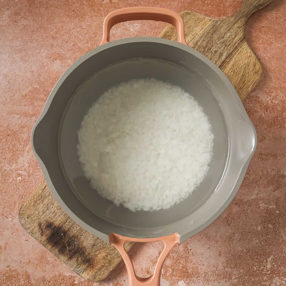 rice and water in a pot.