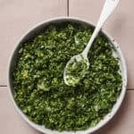 gremolata in a bowl with a spoon.