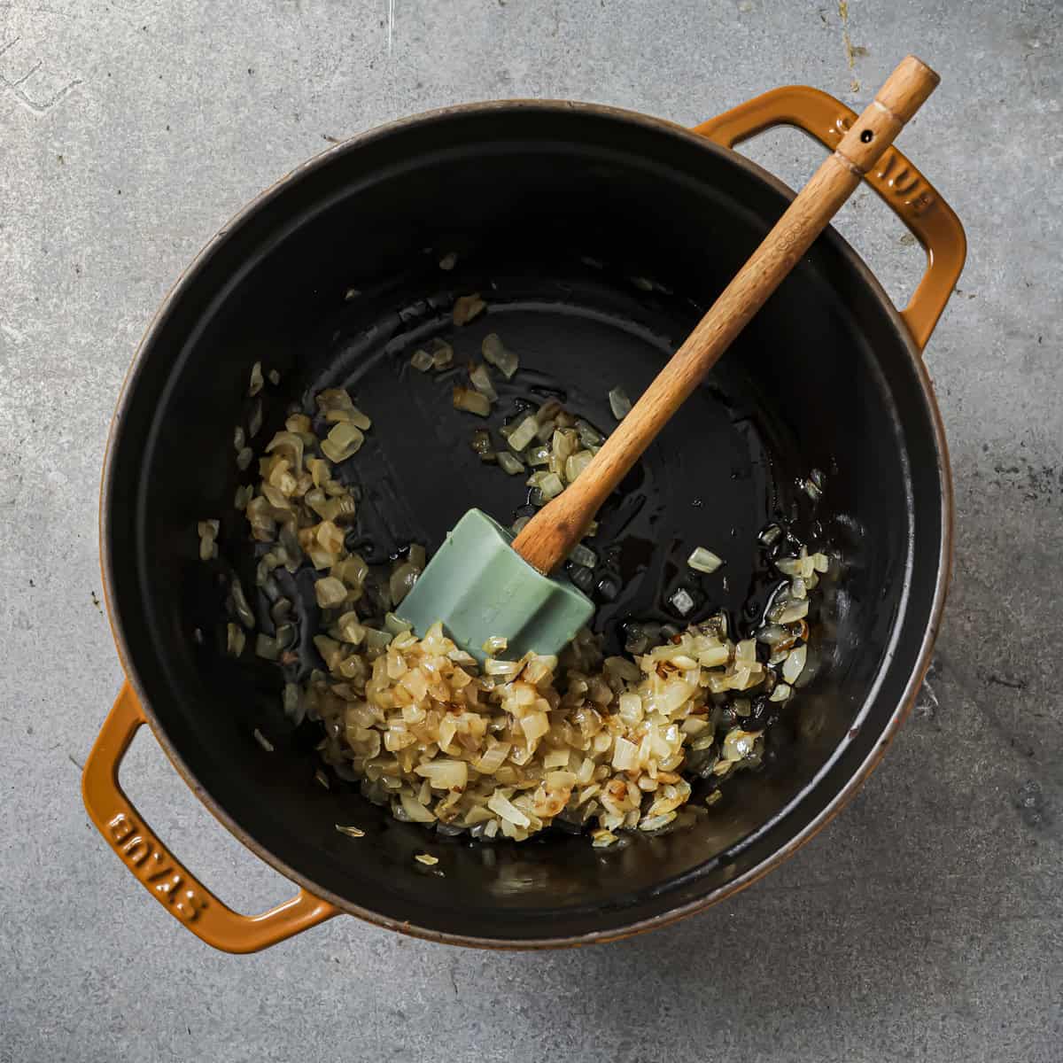 golden brown onions in stockpot after they've been cooked.