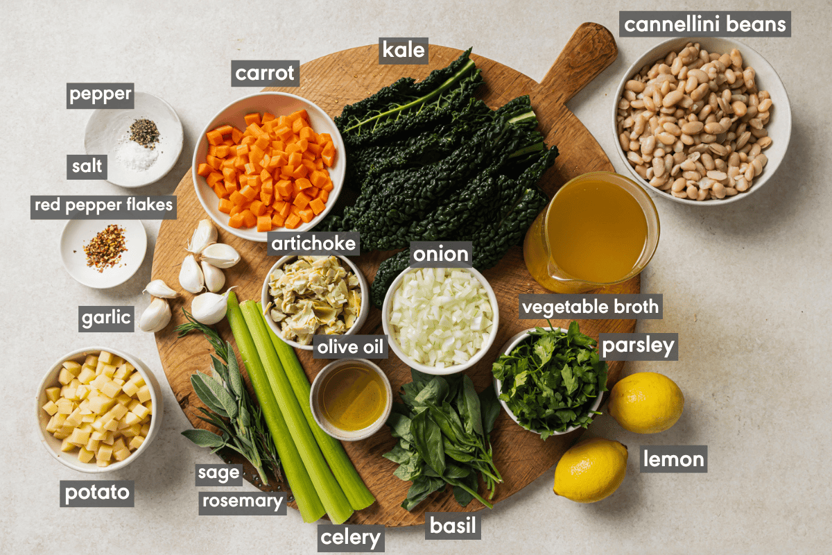 ingredients for soup in various small bowls on a wooden cutting board.