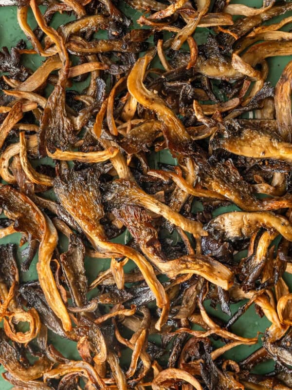 close up of crispy mushrooms on a baking tray.