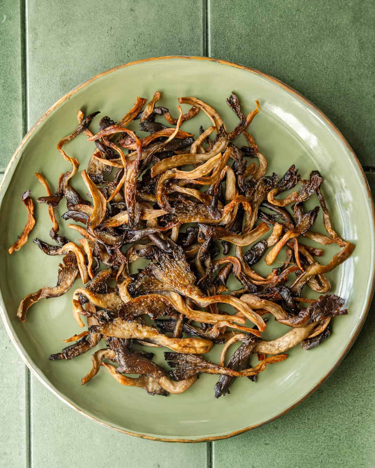 crispy roasted mushrooms on a plate.