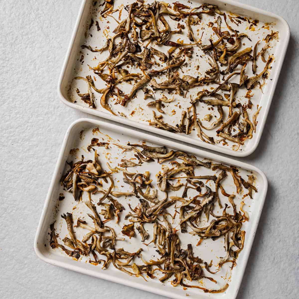 mushrooms on the sheet pans after they've been roasted.