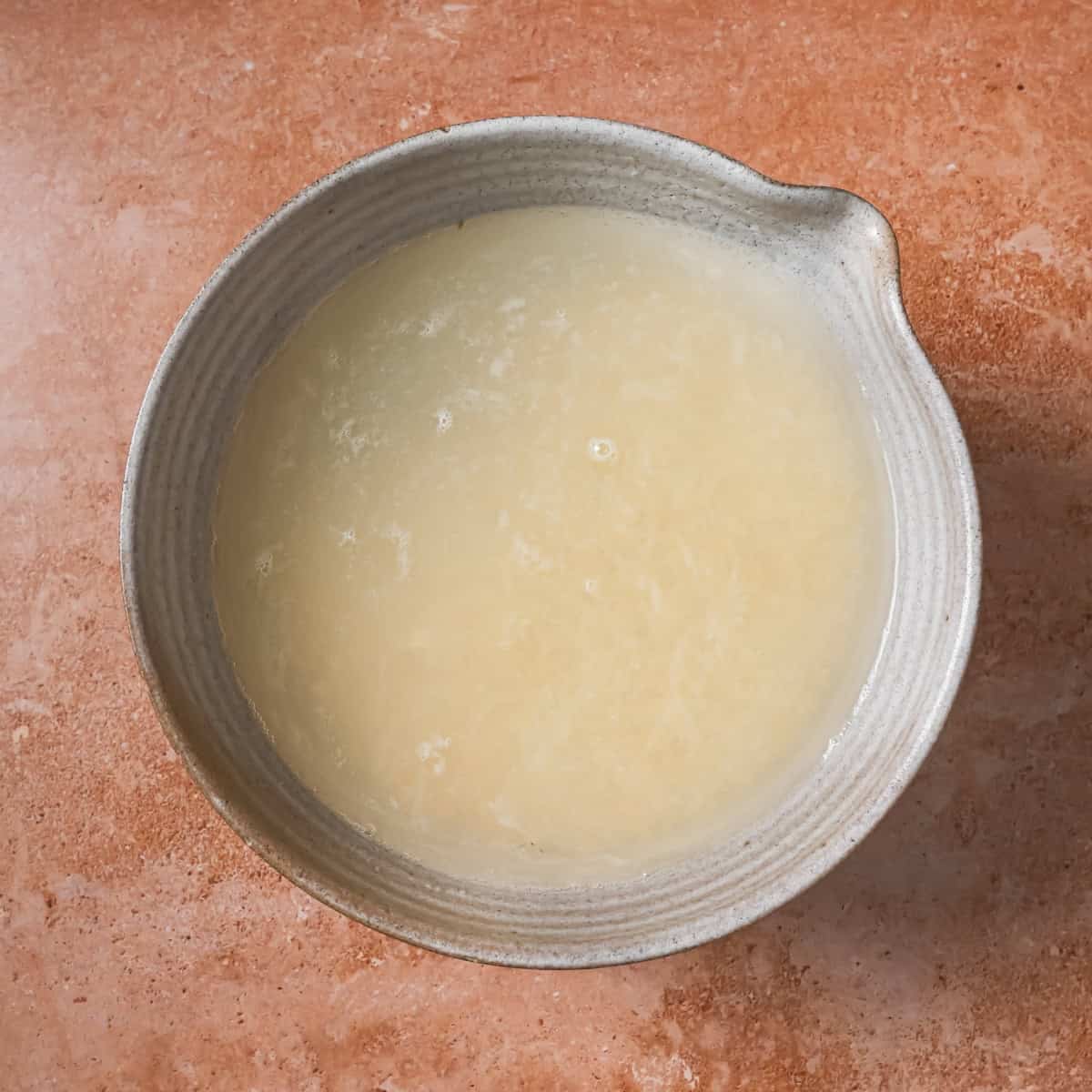 lentils soaking in a bowl of water.