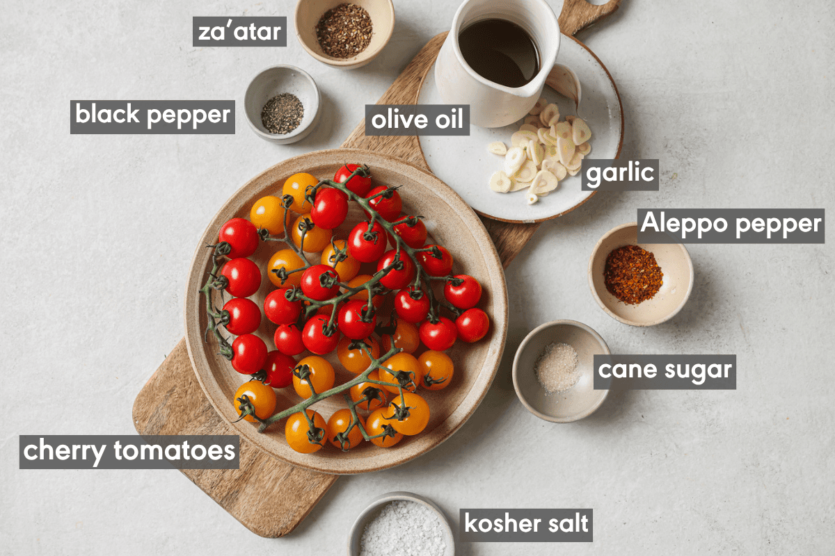 ingredients for confited tomatoes in various small bowls on a table.