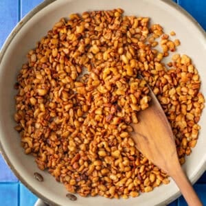 tempeh nuggets in a skiller on a table.