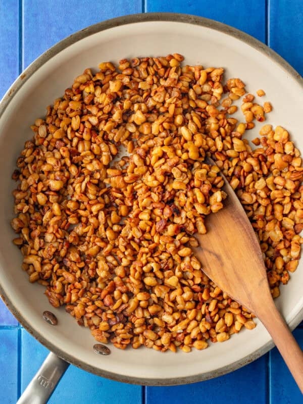 tempeh nuggets in a skiller on a table.