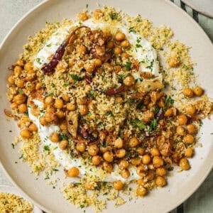 fried chickpeas and yogurt sauce on a plate.