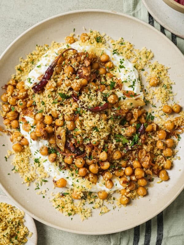fried chickpeas and yogurt sauce on a plate.