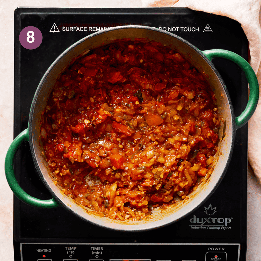 tomatoes cooked down in pot.