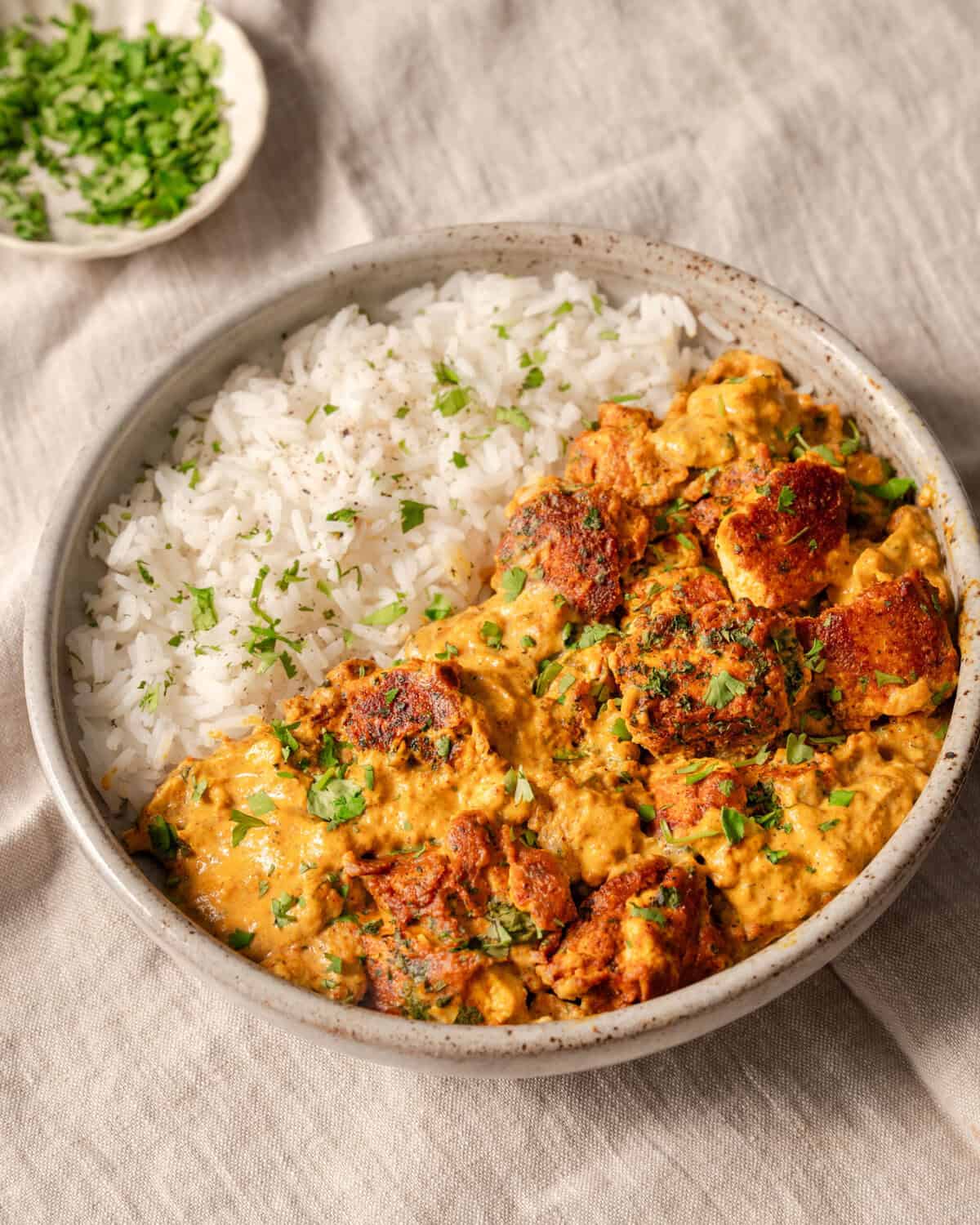 Indian tofu curry and rice in a bowl.