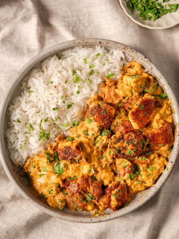 overhead view of tofu curry with rice in a bowl.