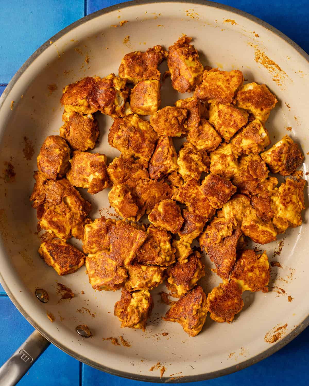 pan fried tofu in a saucepan.