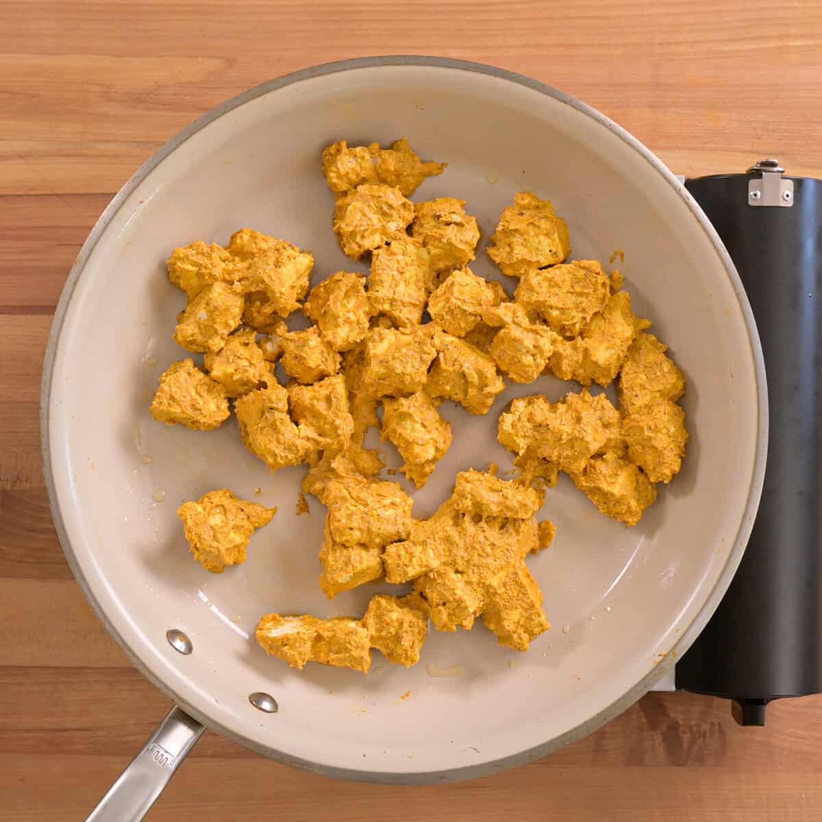 marinated tofu cooking in the saucepan.
