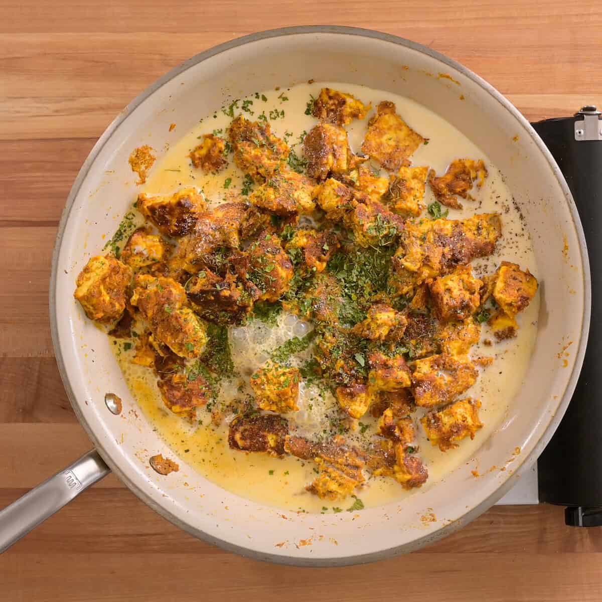 soy milk, fenugreek leaves, salt and pepper in the saucepan before being simmered together.