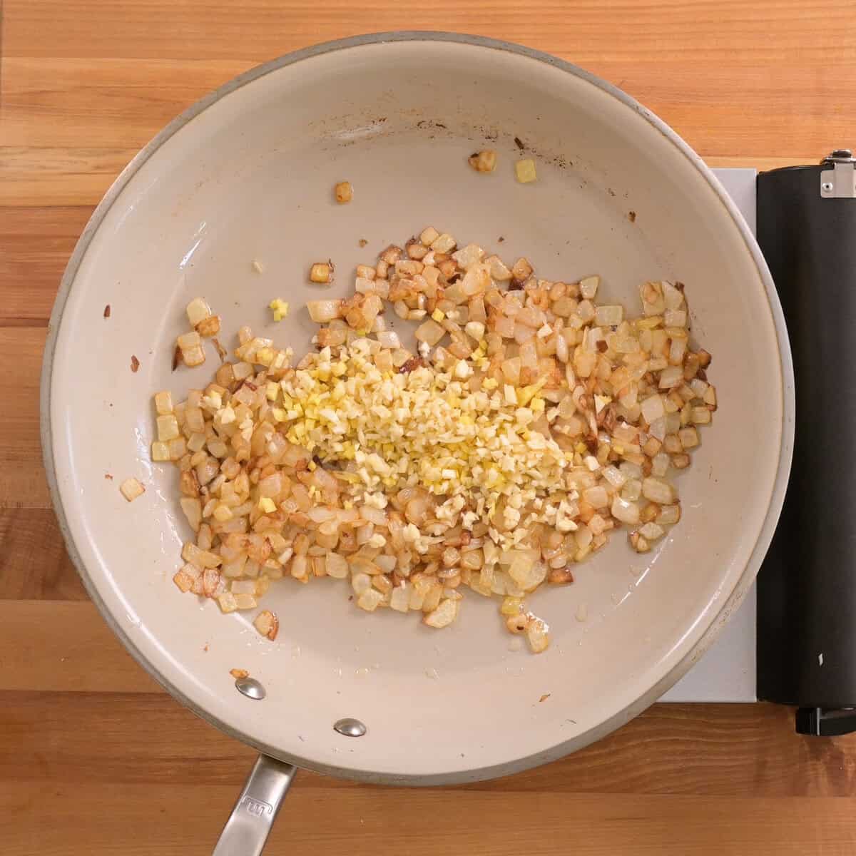 garlic and ginger added to sauteed the onions in the pan.