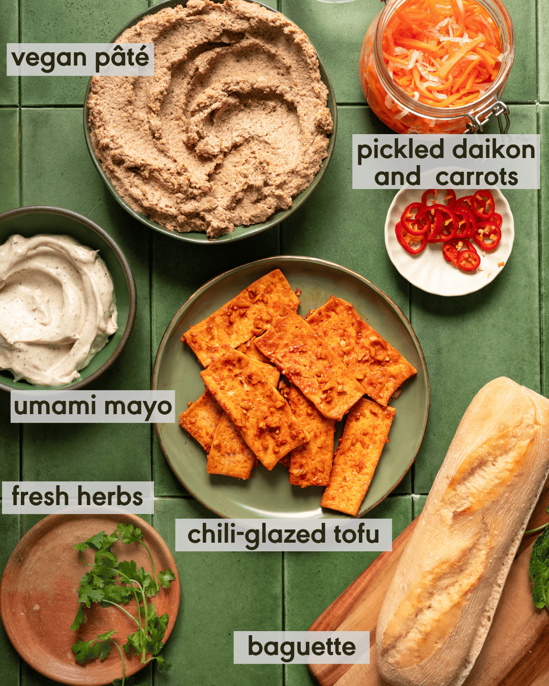 Labeled components for vegan banh mi, including pickled daikon and carrots and vegan pate.