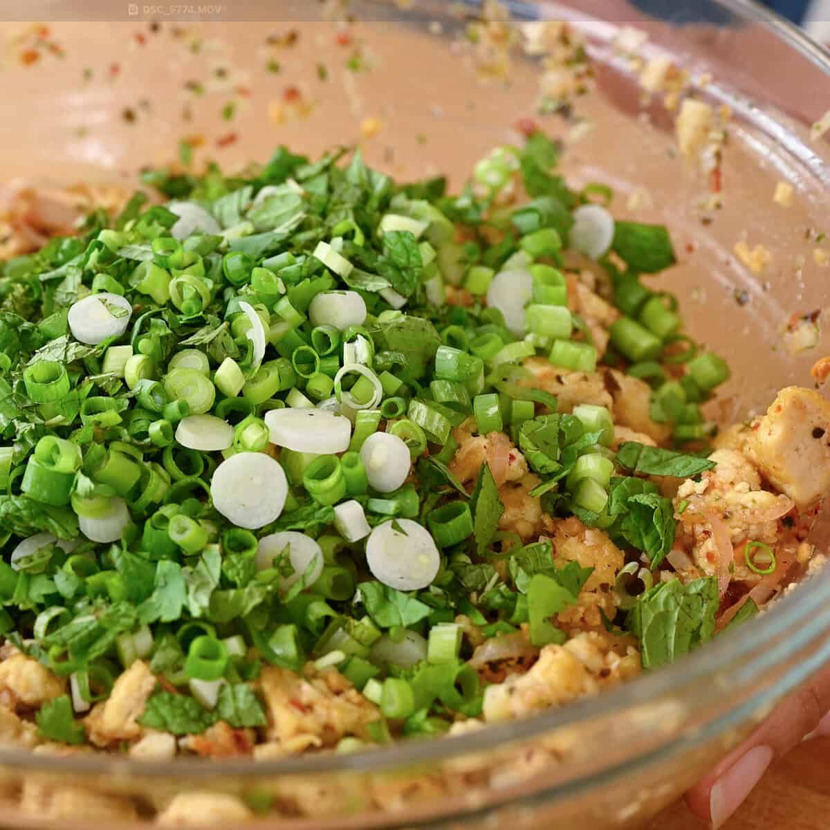 fresh chopped herbs added to the tofu laab salad.