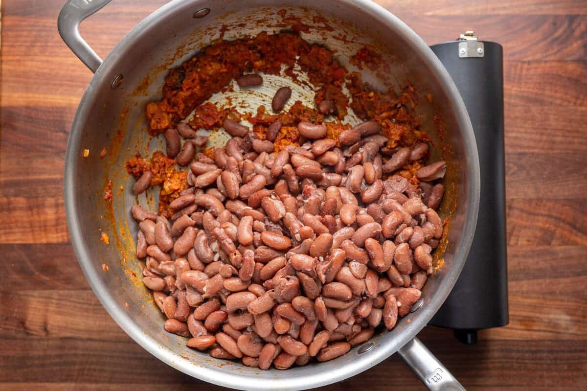 beans and masala in a deep frying pan.