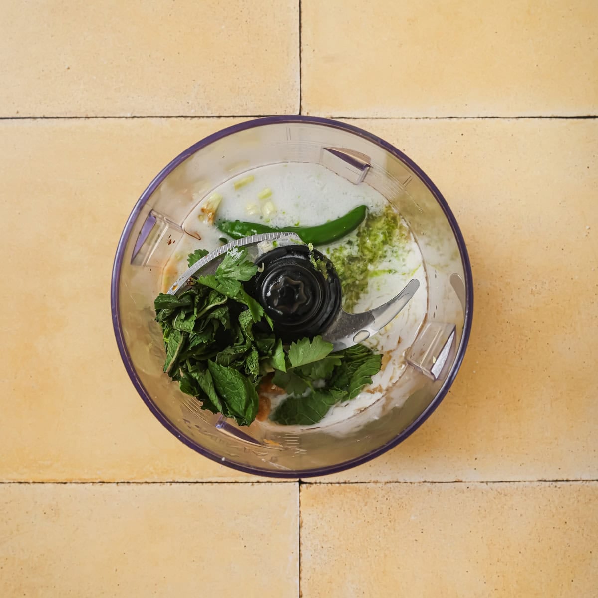 salad dressing ingredients in a food processor before being blended.