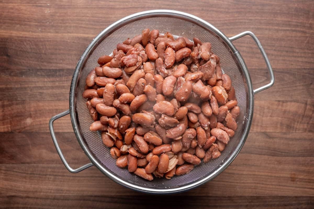 cooked kidney beans in a colander.