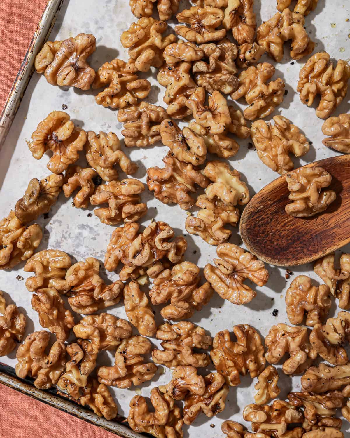 baking sheet with roasted walnuts.