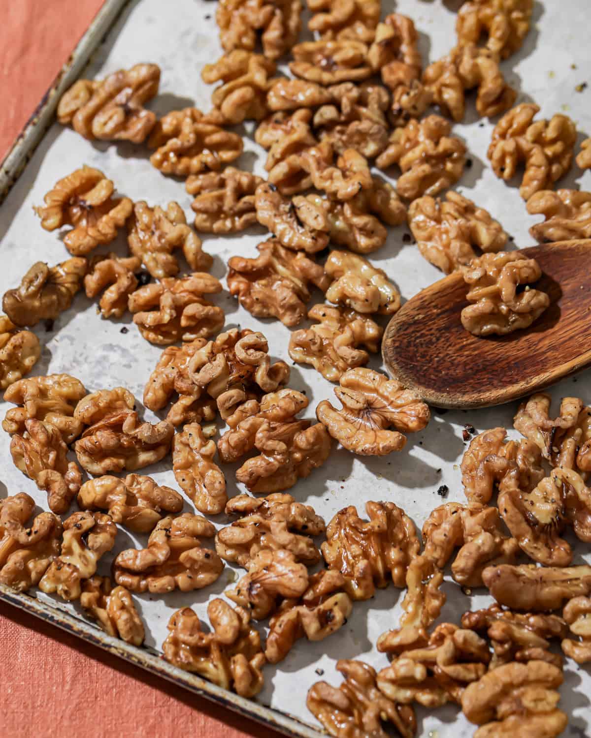 baking sheet with roasted walnuts.