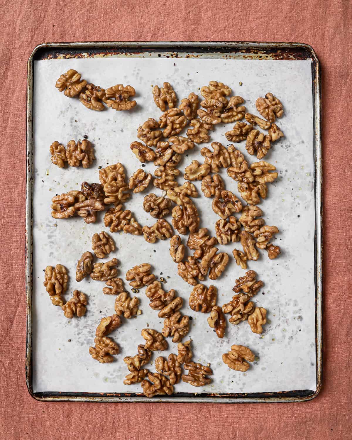 fully roasted walnuts on the baking sheet.