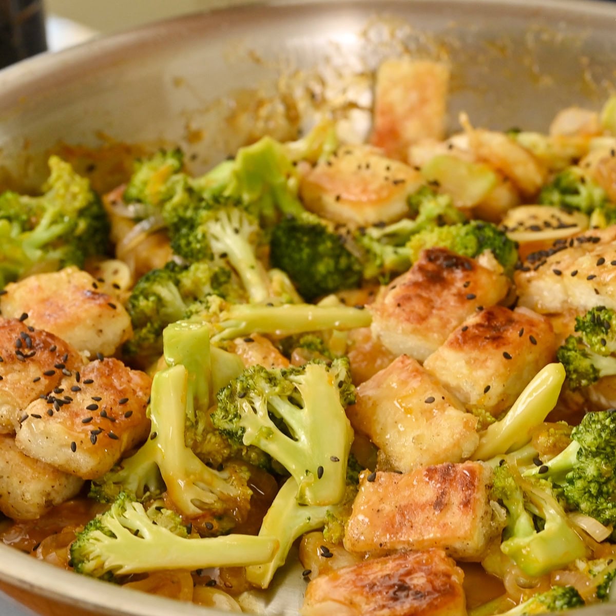 Sesame seeds sprinkled atop the finished tofu and broccoli stir-fry.