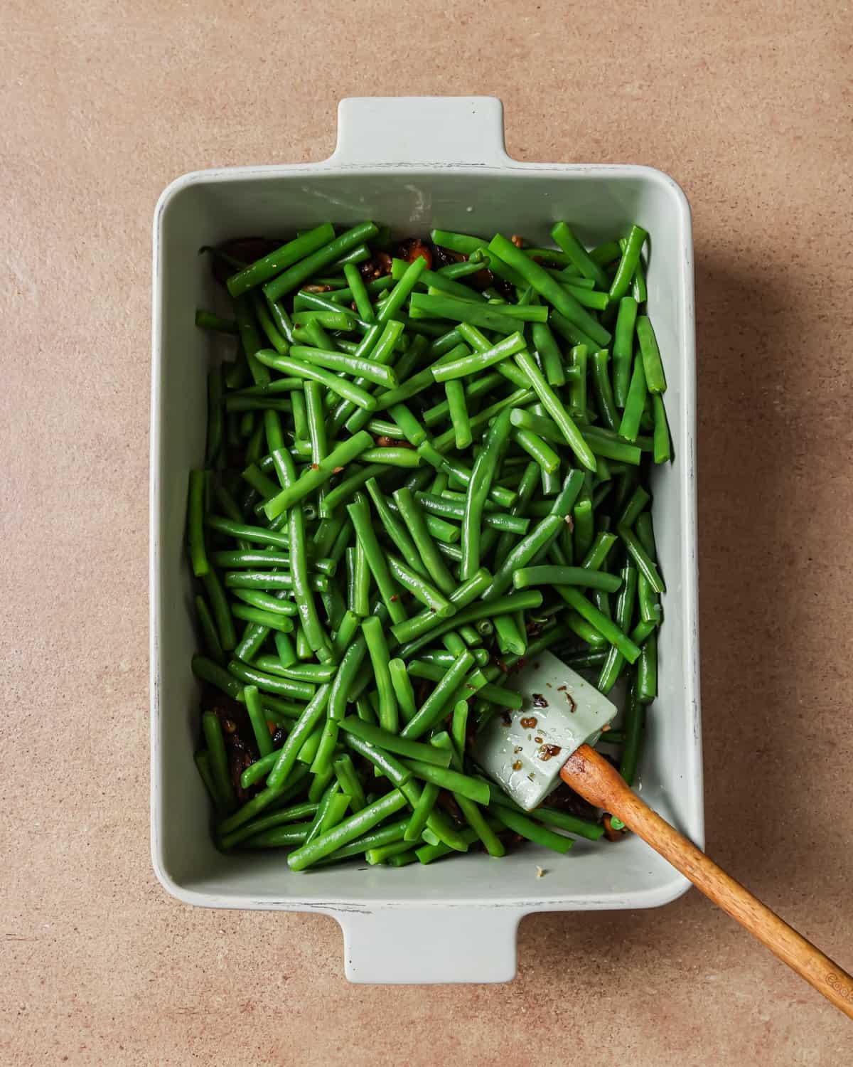 blanched green beans in a baking dish.