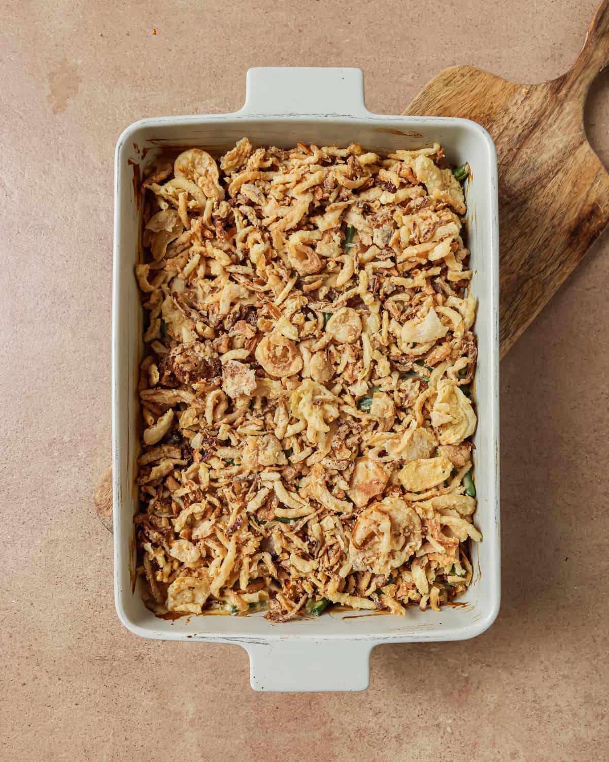 green bean casserole topped with crispy fried onions before being baked for the last 10 minutes.